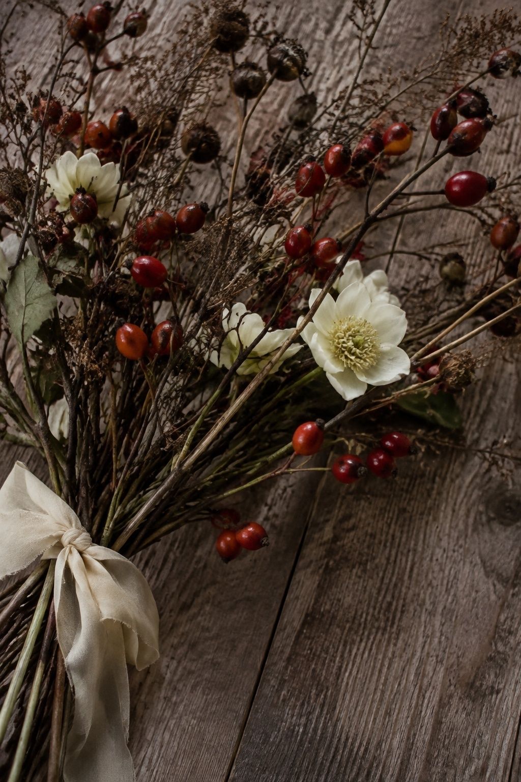 seed pods and rose hips for foraged detail for an intimate January wedding