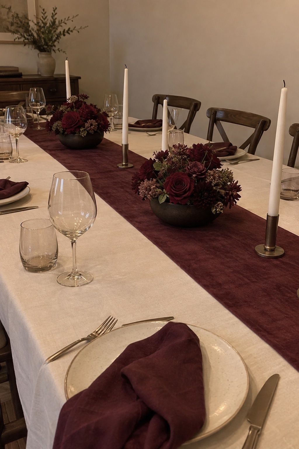 January wedding table in ivory, champagne, plum, cocoa, and deep wine.