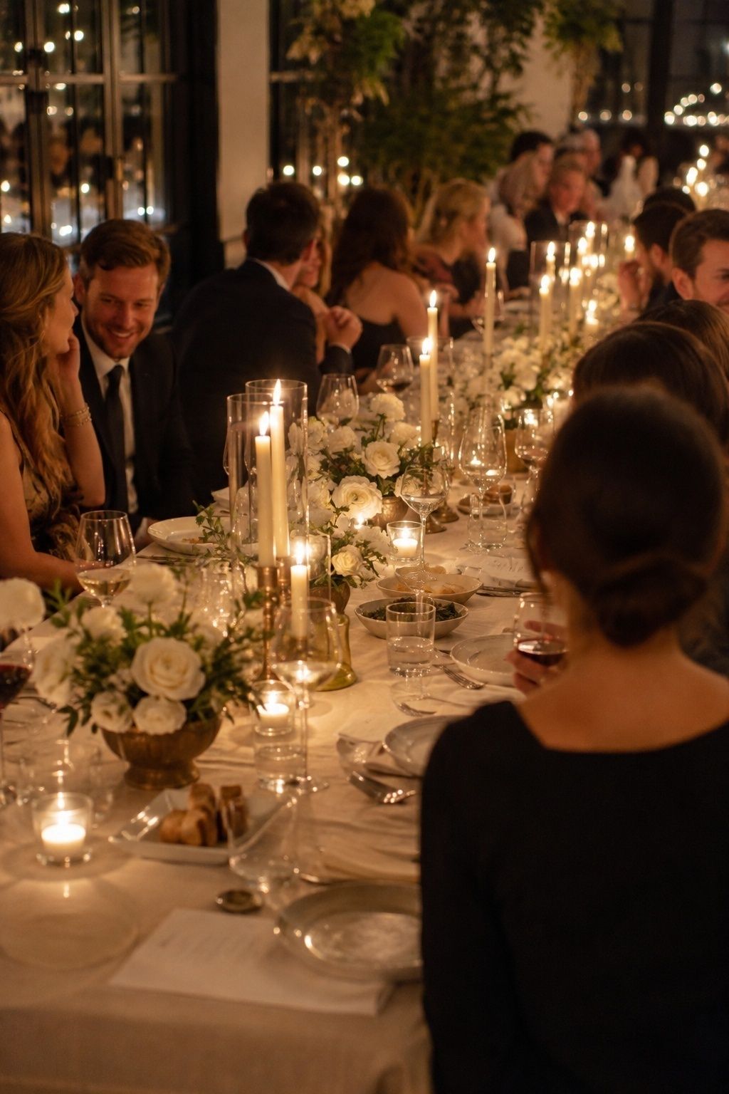 Candle clusters down one long winter table