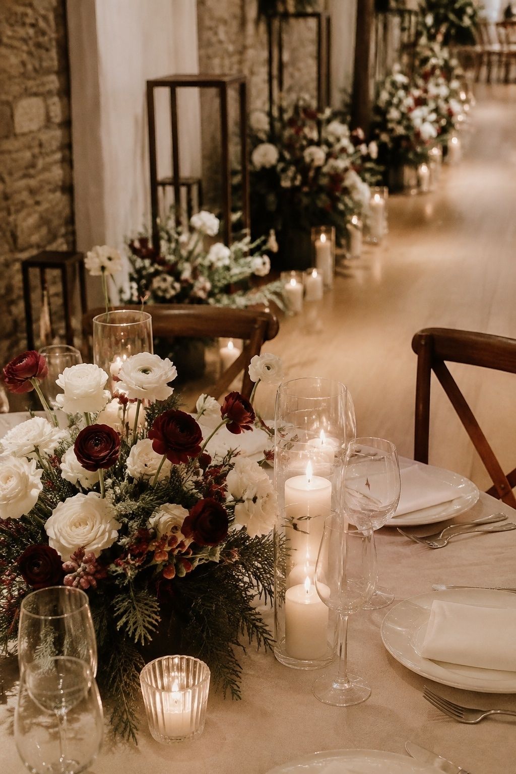 Ruby flowers, evergreen and warm white winter wedding decor