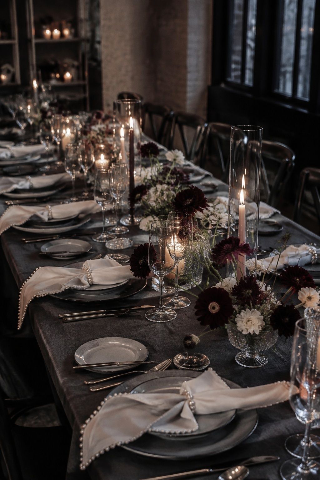 Plum flowers, charcoal linen and pearl details at a winter wedding