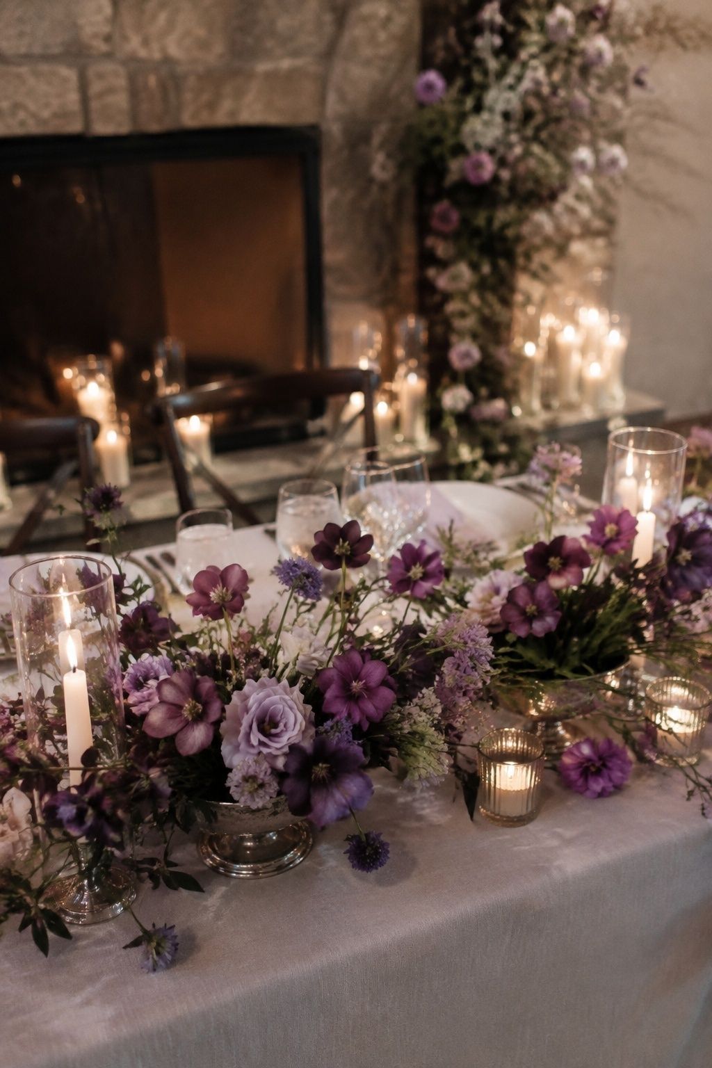 Amethyst winter wedding flowers with silver table details