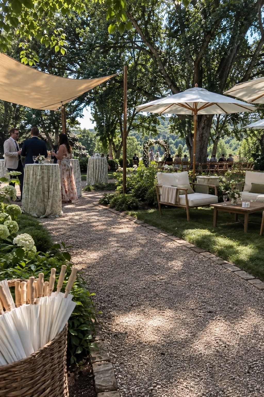 Shade sails, umbrellas, and trees covering a small outdoor July wedding