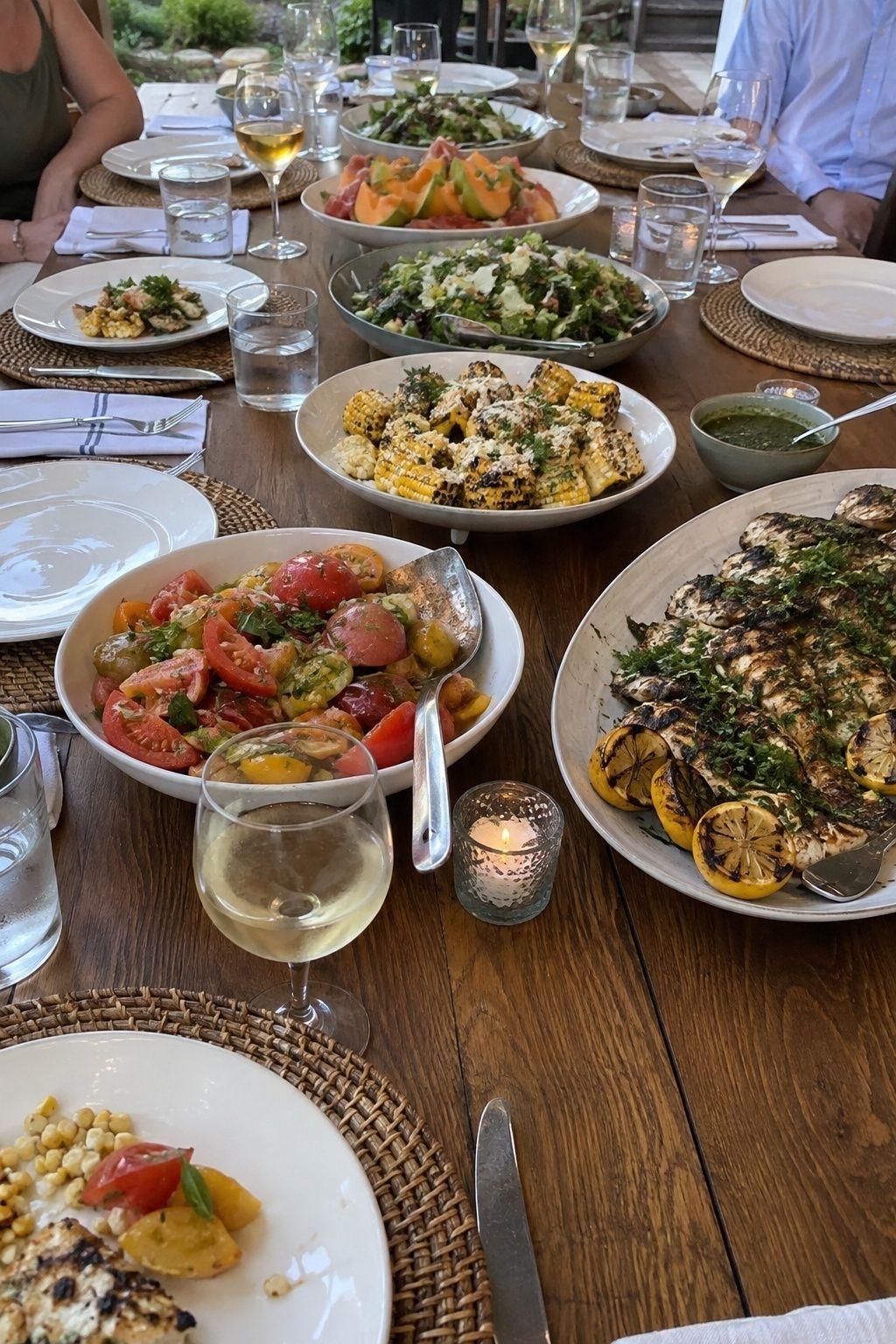 Light family-style July wedding menu with grilled fish and summer vegetables