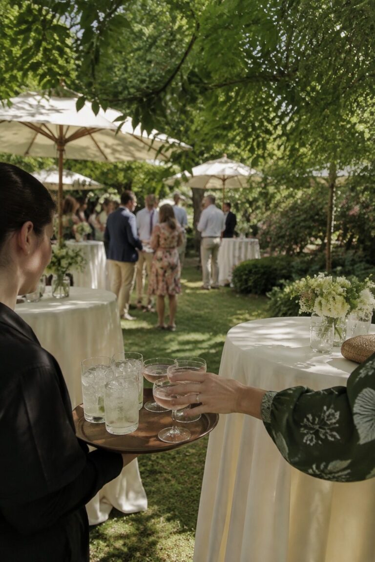 Shaded garden cocktail hour at an intimate June wedding reception