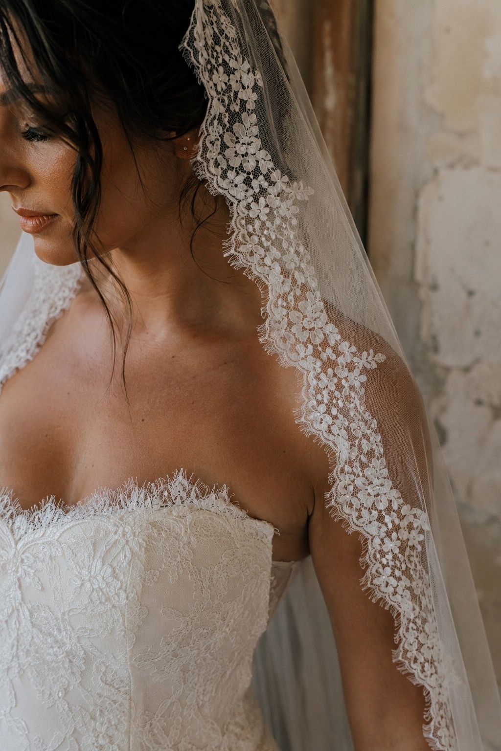 Fine gown lace paired with a complementary mantilla border