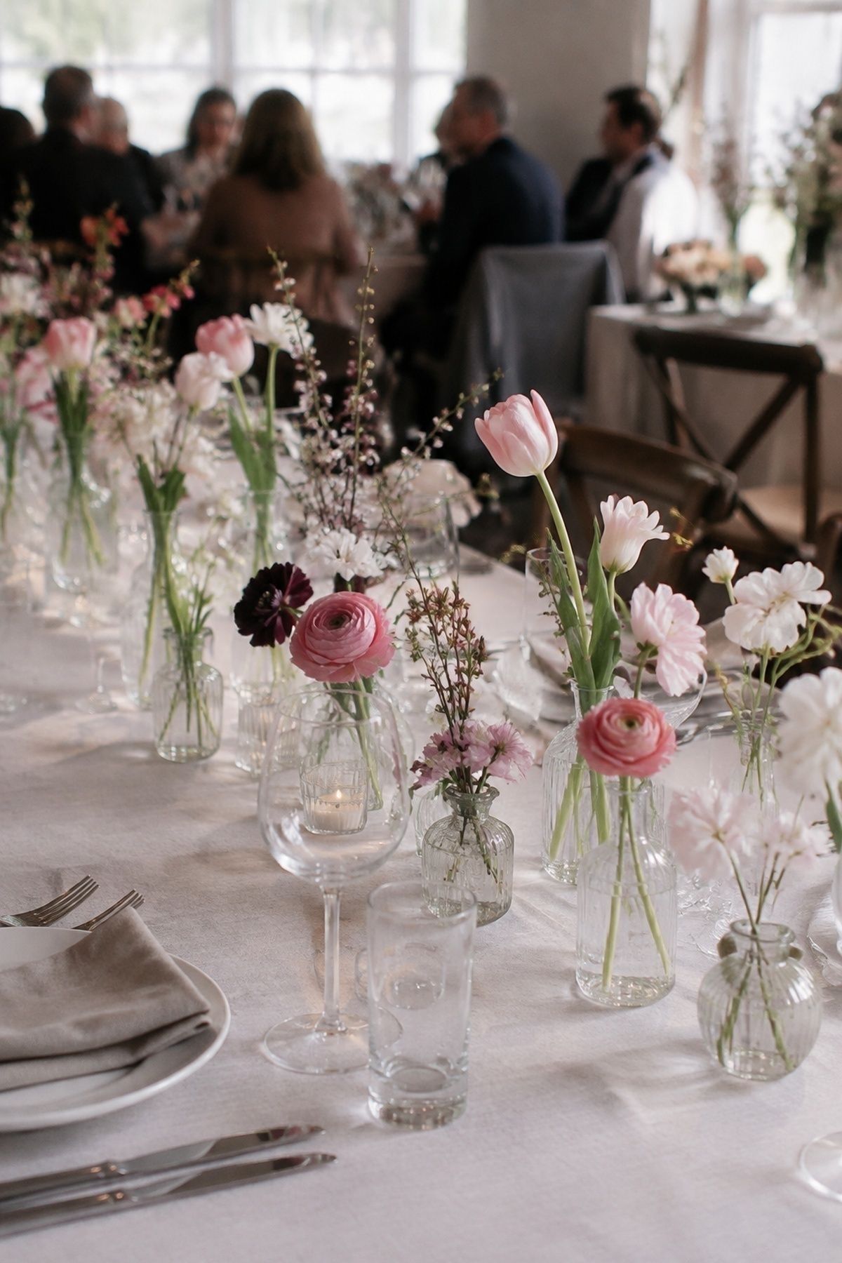 Bud vases with tulips and ranunculus