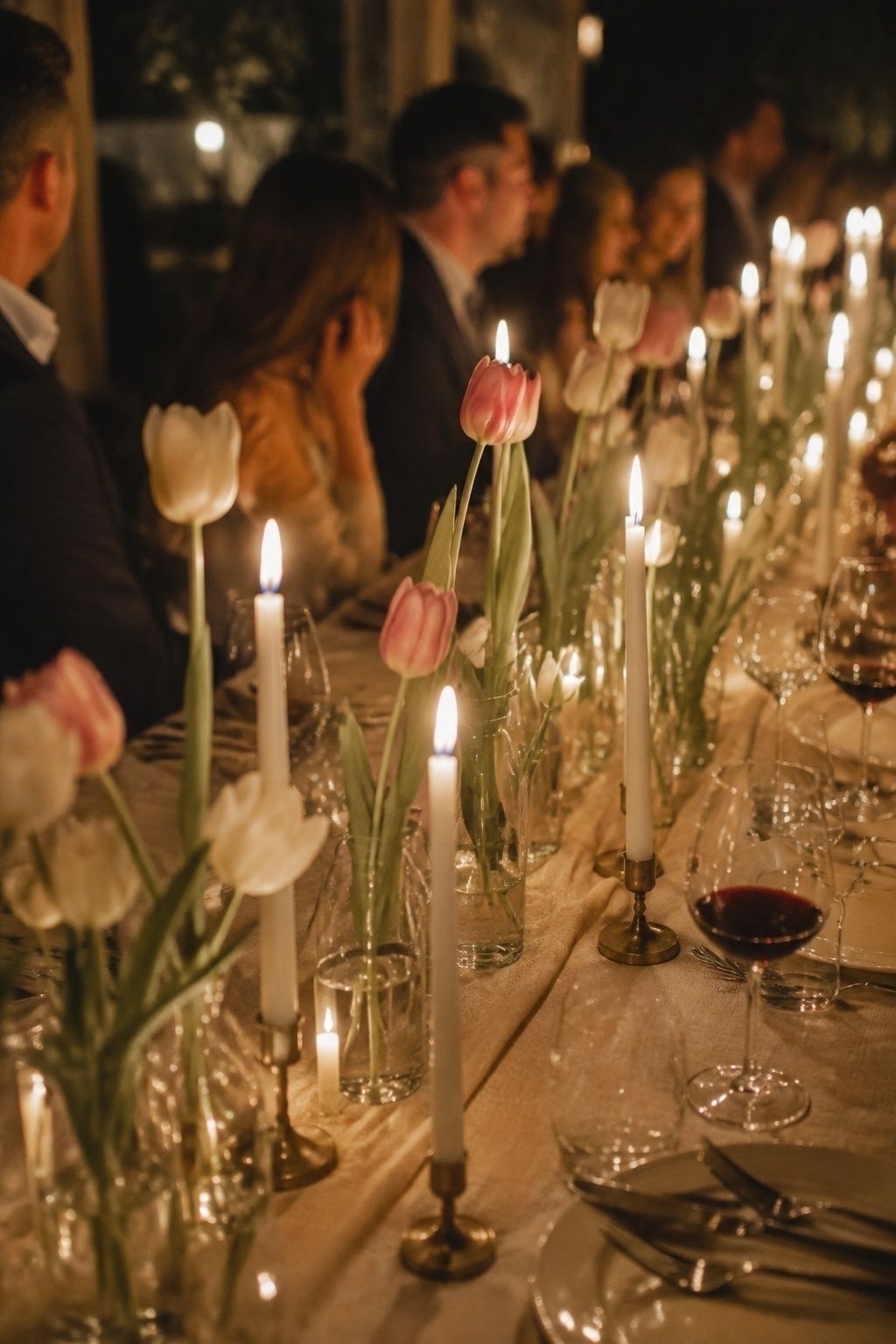 Tulips and taper candles on a celebration table