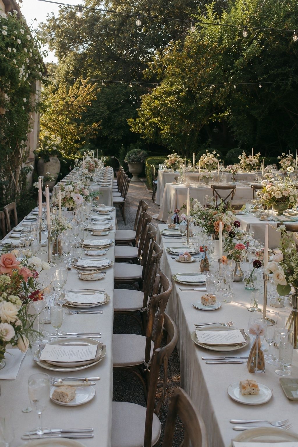 Garden reception table with flowers at mixed heights