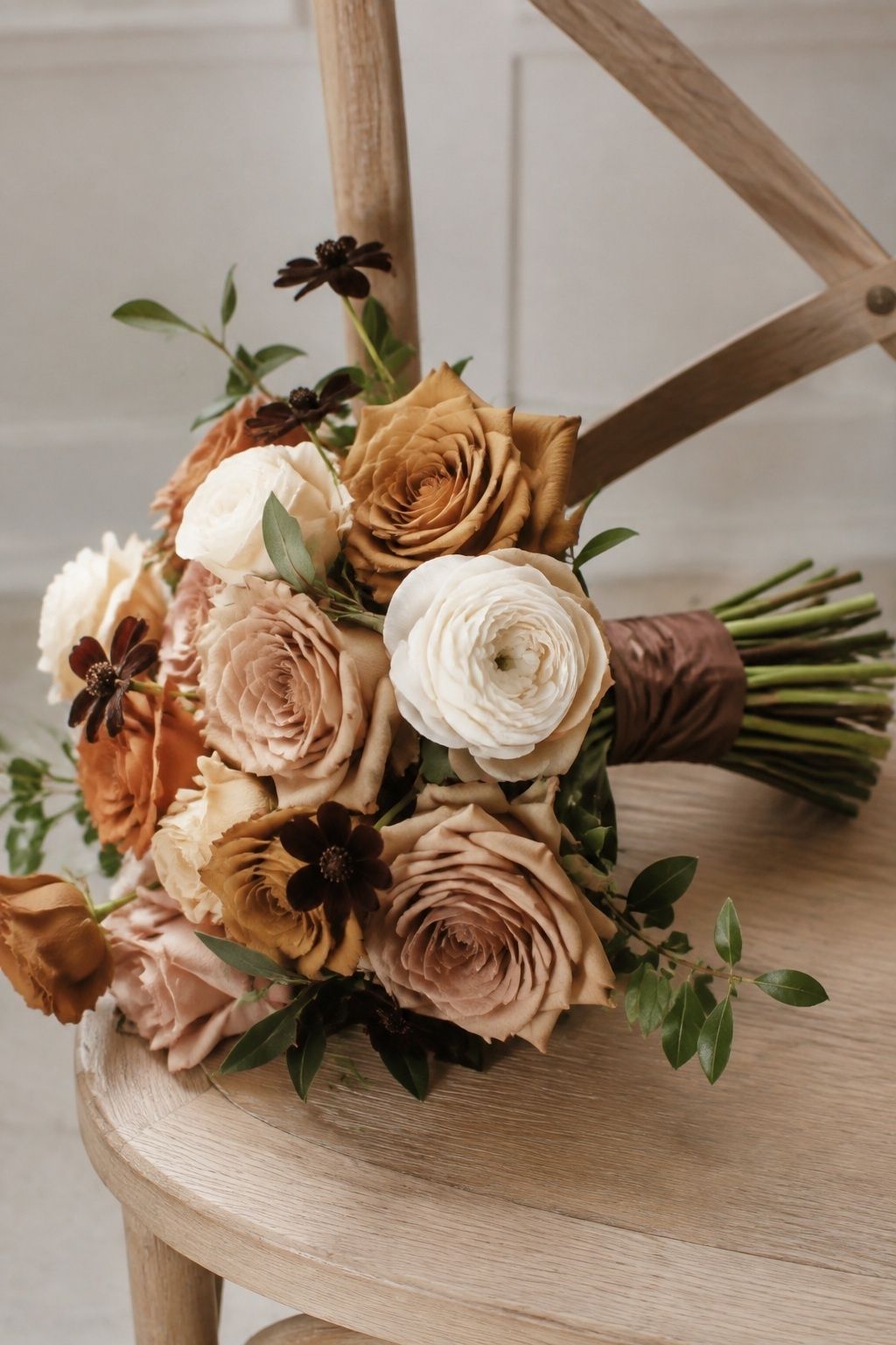 Cappuccino rose bridal bouquet with cream flowers, chocolate cosmos and mocha ribbon.