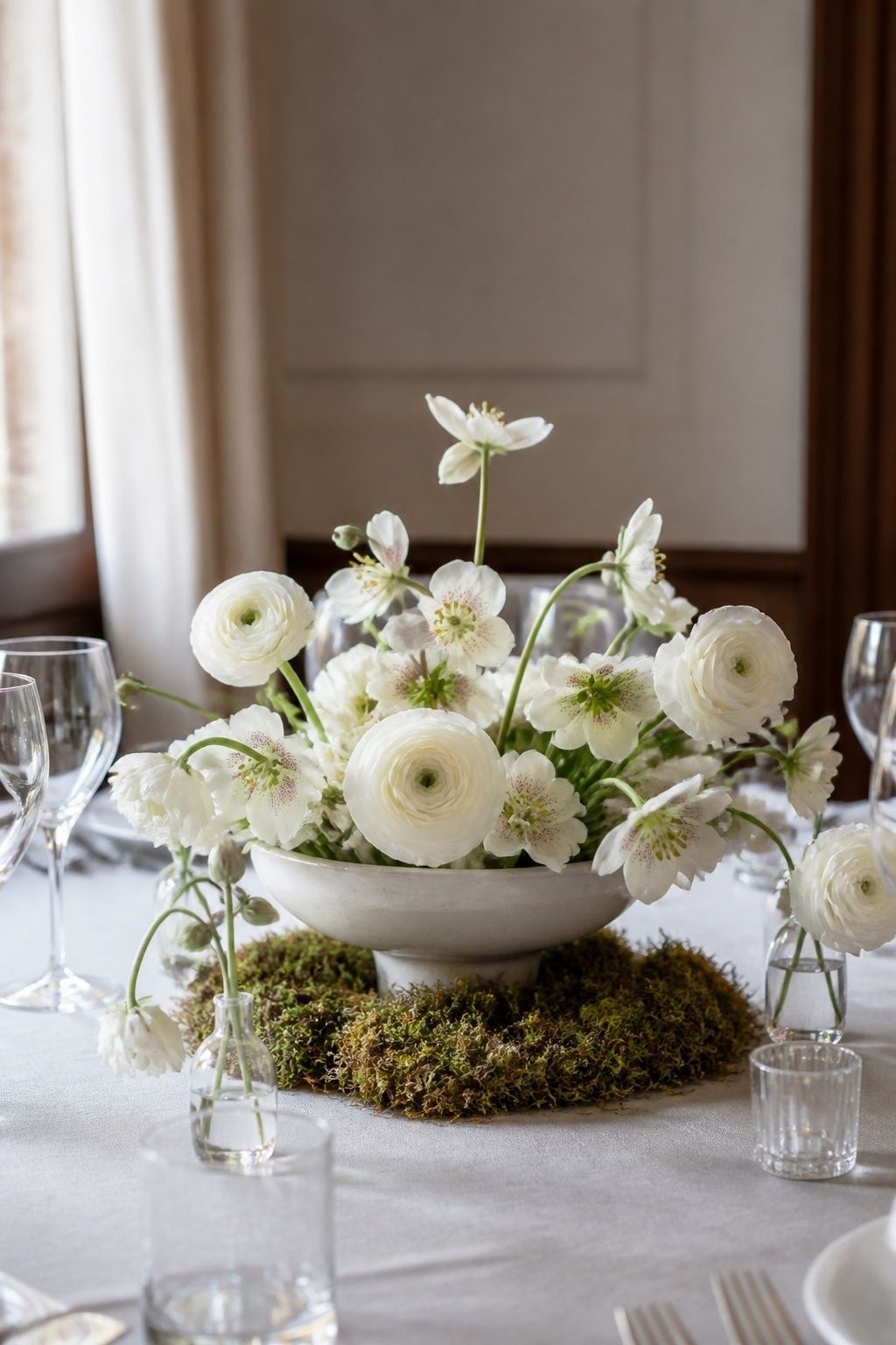 Moss around low floral centerpieces