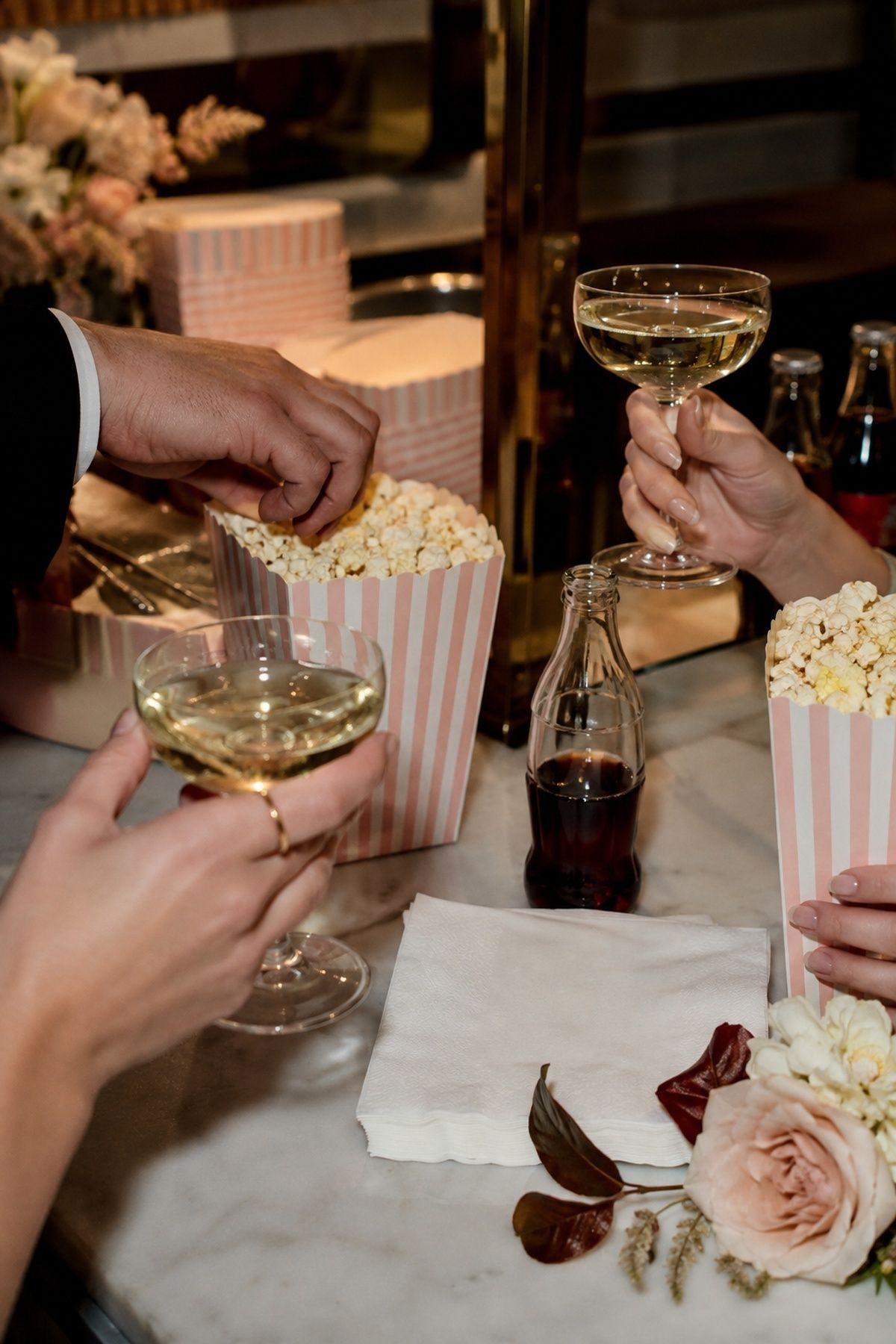Popcorn and champagne before a movie theatre wedding ceremony