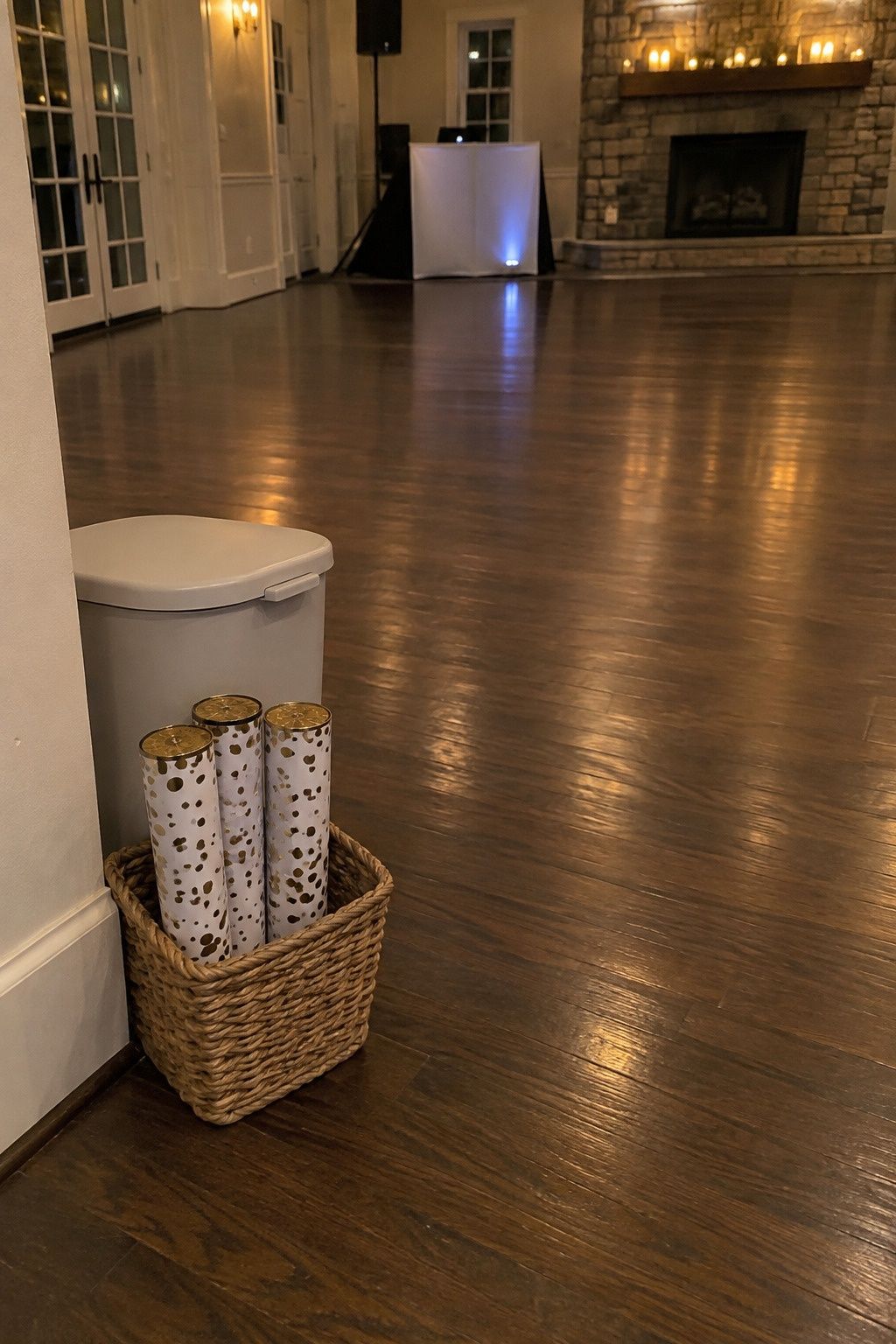 Unopened approved poppers wait in one basket by a clear, dry dance floor with cleanup nearby