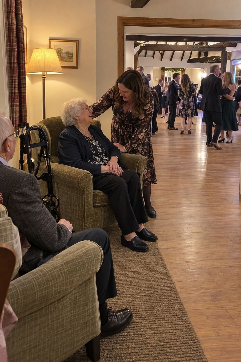 A granddaughter helps an older wedding guest settle into accessible backed seating beside a clear reception aisle.