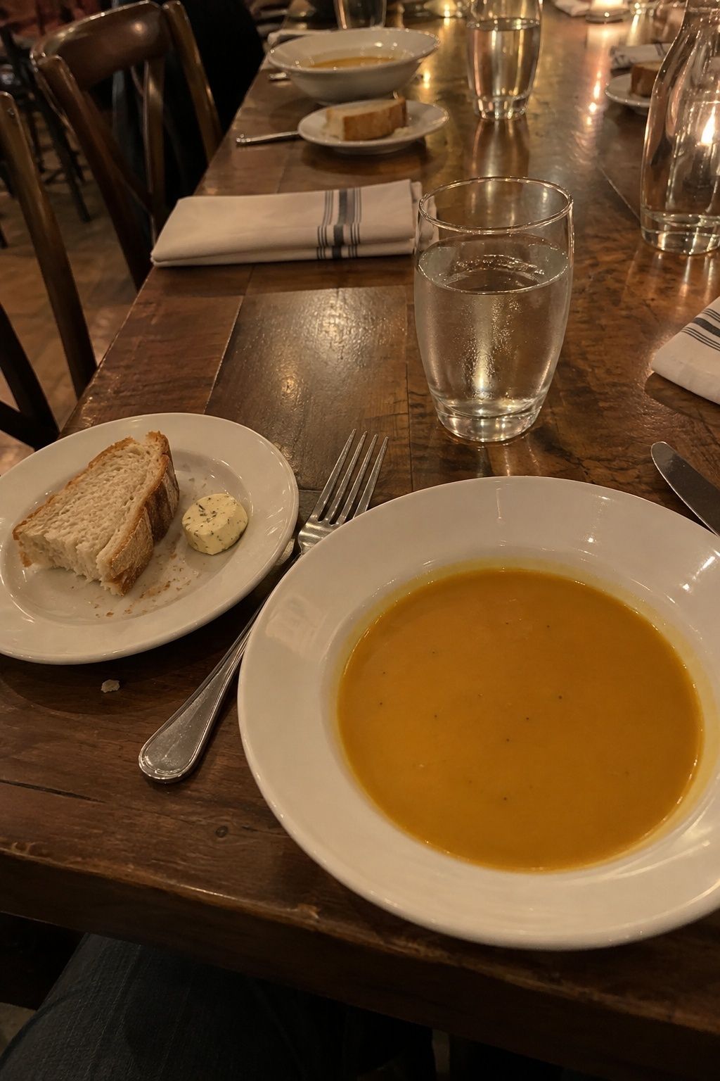 Butternut squash soup served as a November wedding first course.