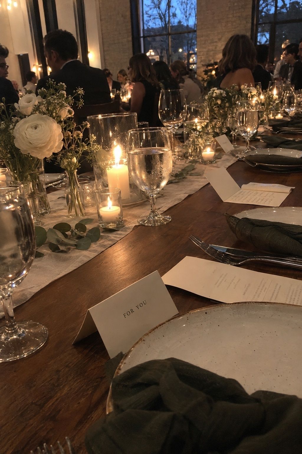 Personal notes and wish cards arranged at November wedding place settings.