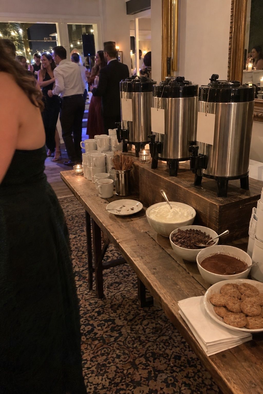 Late-night hot drink station beside a November wedding dance floor.