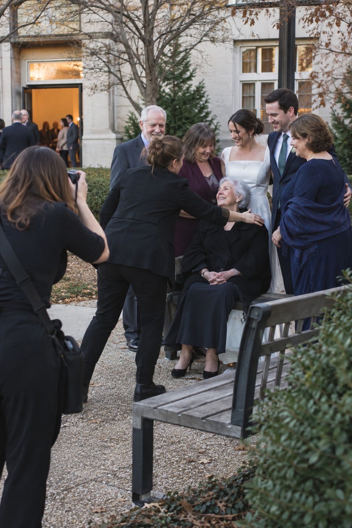 A wedding team gathers family for essential November portraits before darkness.