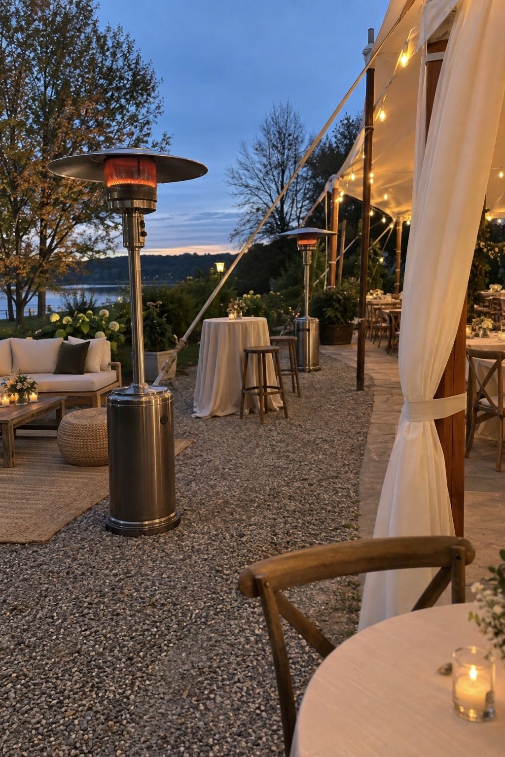 Outdoor wedding heaters placed safely beside a reception tent with clear walking space