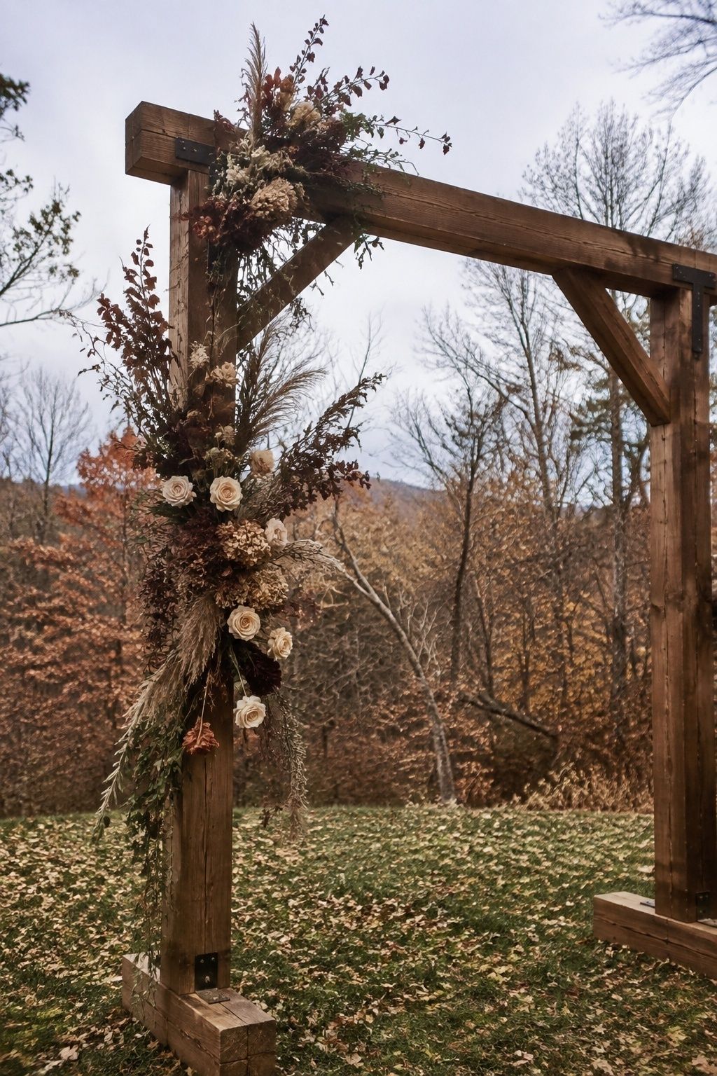 Natural wood wedding arch with secure autumn florals