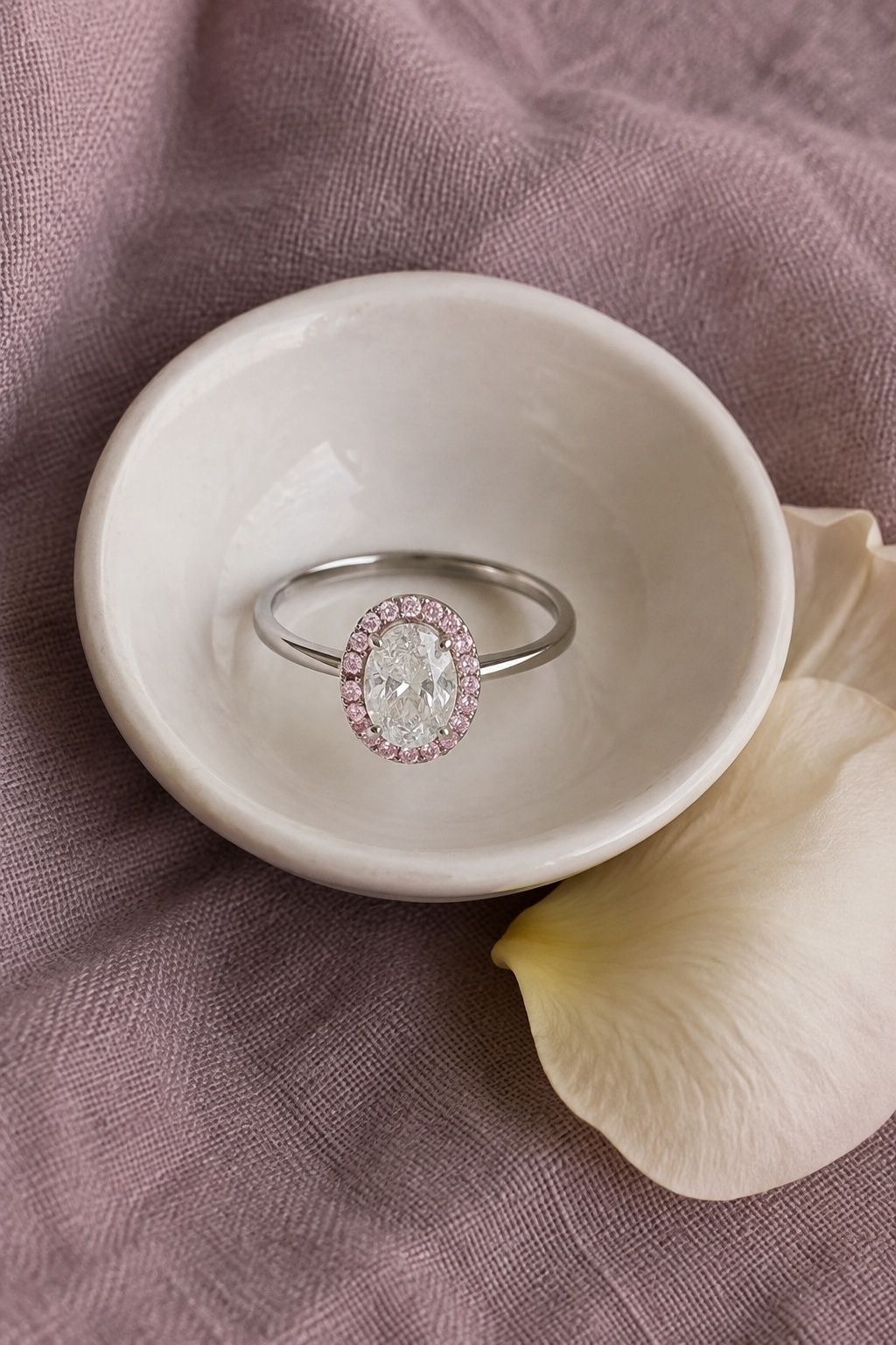 Pink diamond halo around a center stone