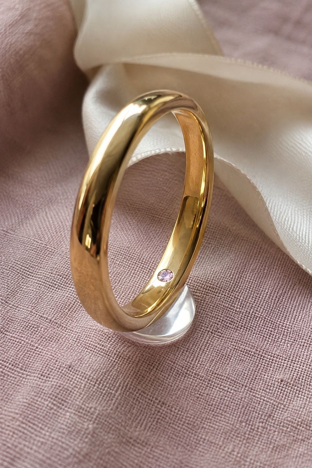 Custom pink diamond band with hidden stones