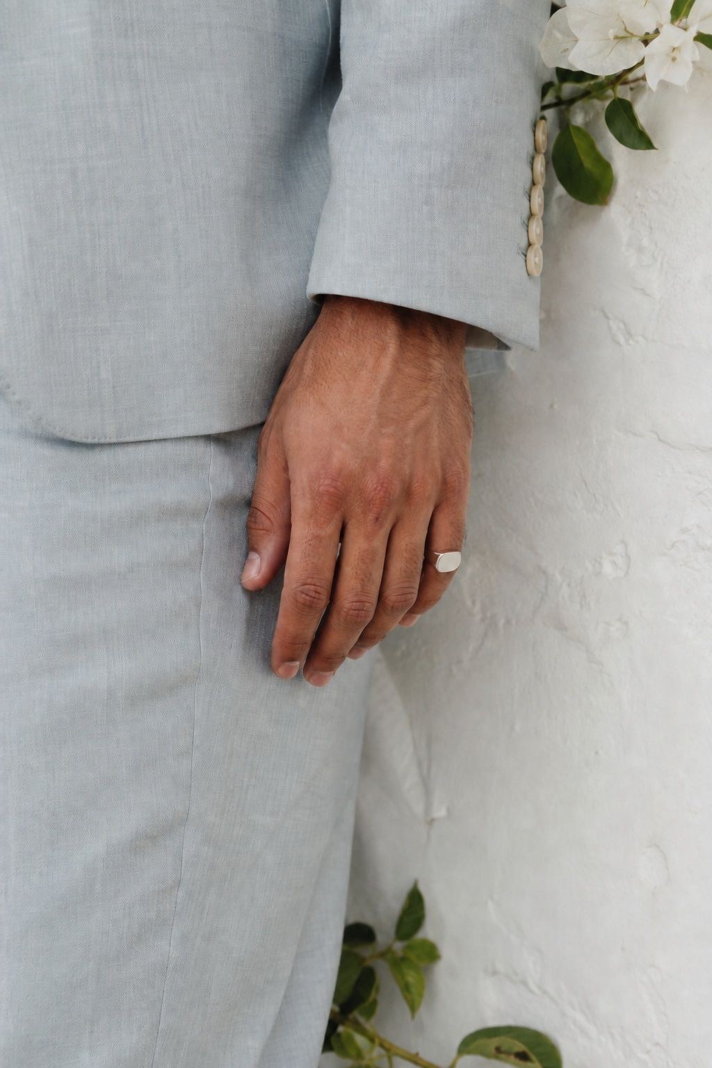 Pinky ring worn with a linen suit