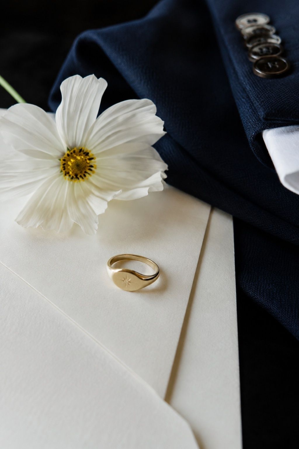 Custom groom's pinky ring engraved with a secret symbol