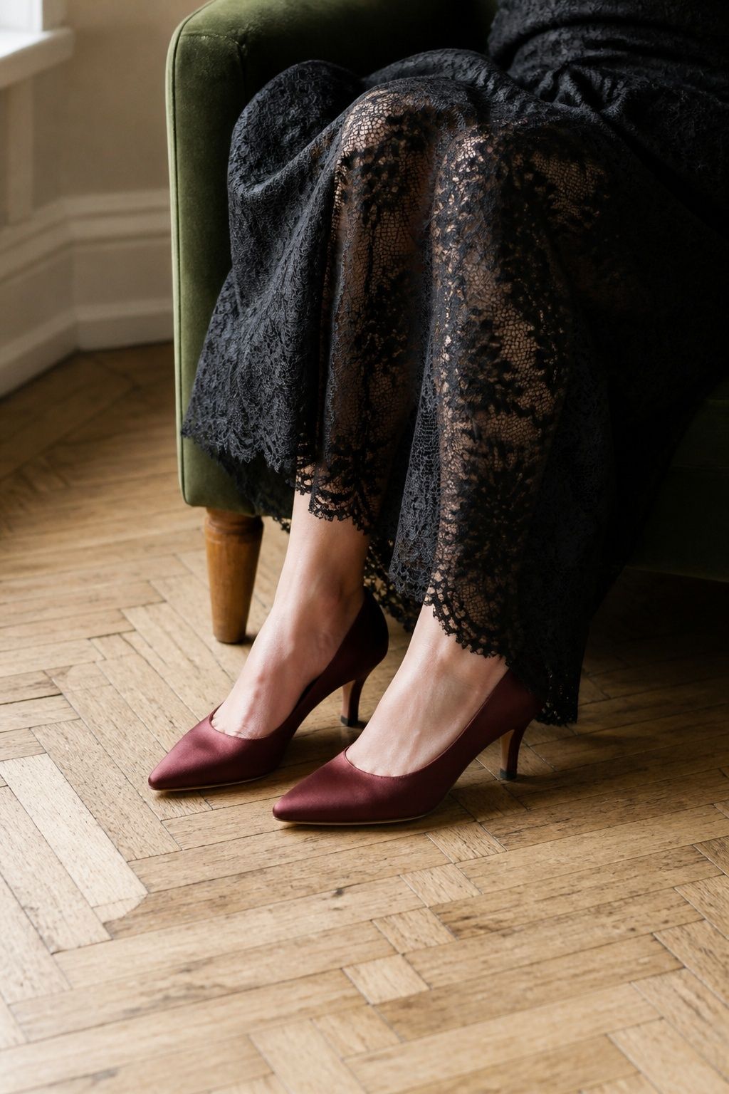 Plum bridal heels worn with a black wedding dress