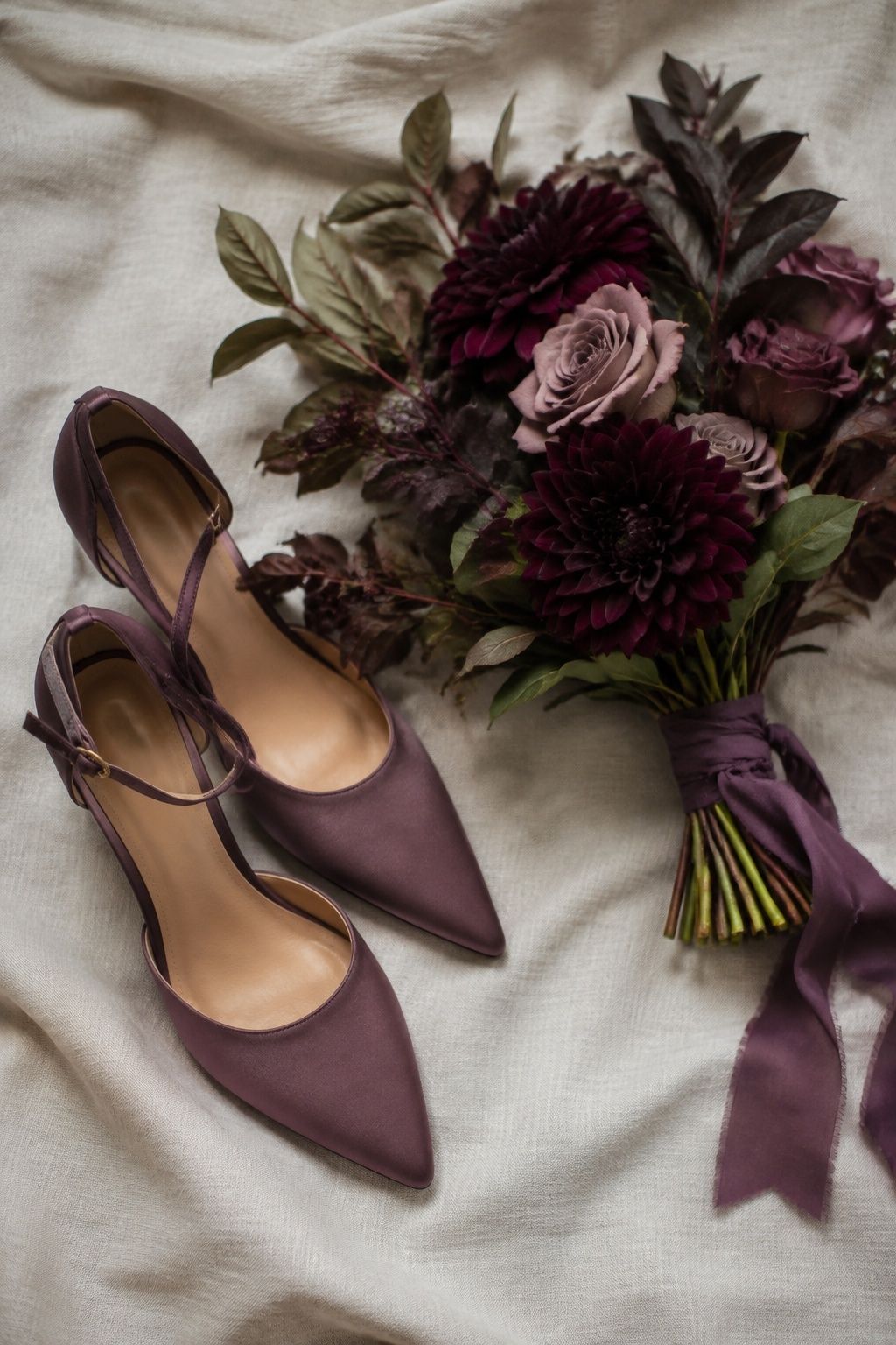Plum shoes matching a moody wedding bouquet