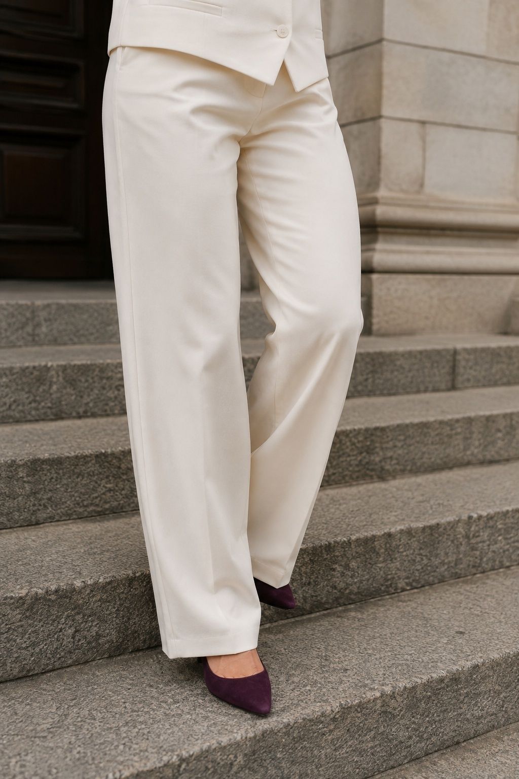 Plum heels worn with a bridal suit