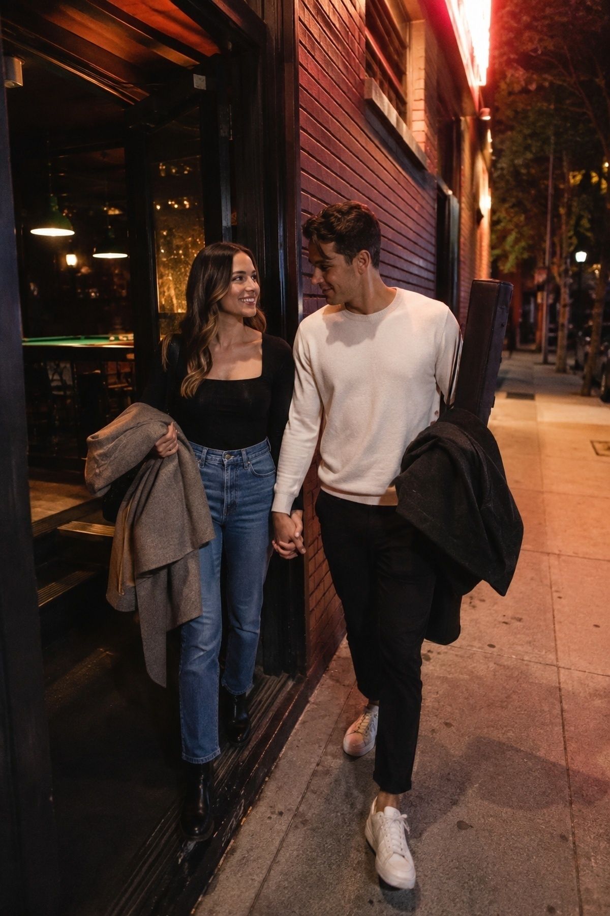 Pool hall engagement couple stepping outside for a brighter sidewalk contrast photo