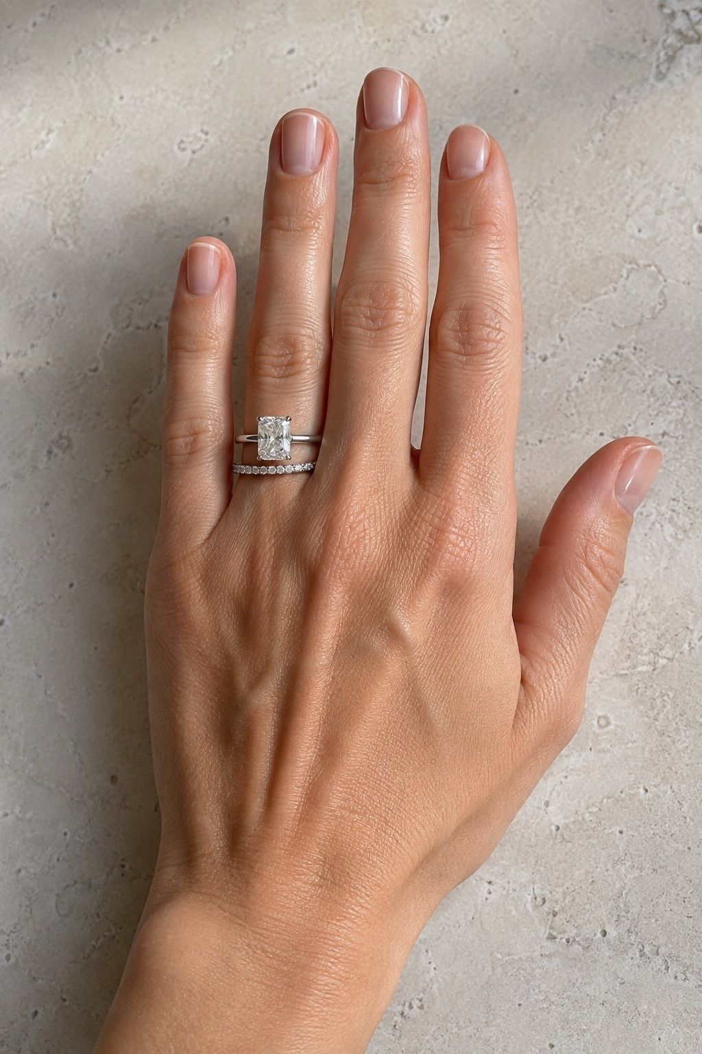 Eternity band balanced against a radiant centre stone