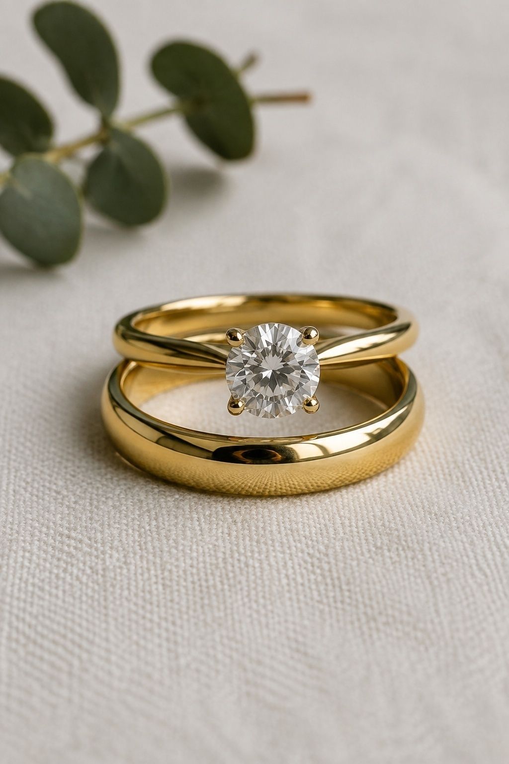 Round solitaire stacked with a plain band