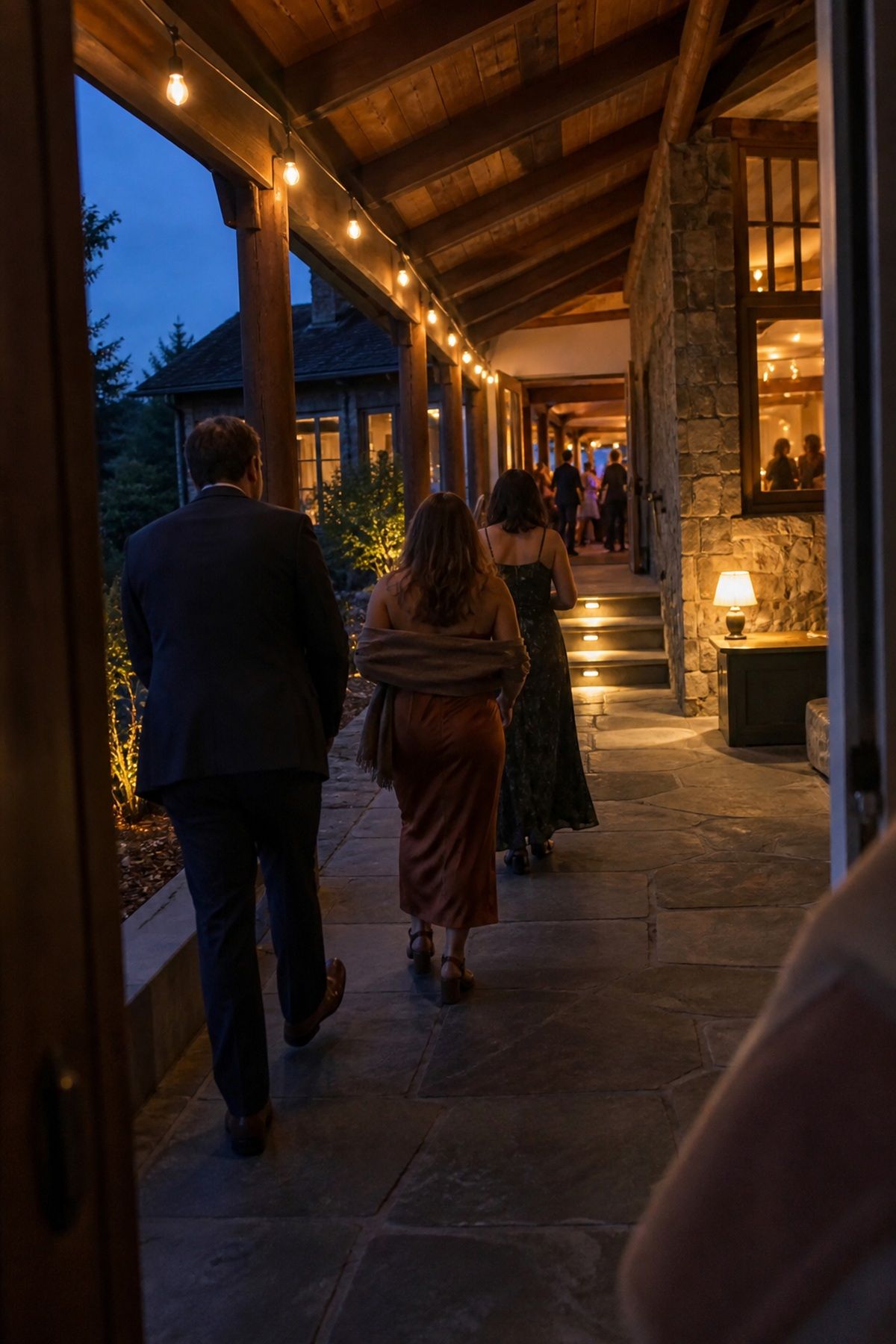 String lights and electric step lights lead guests along a covered route to dancing.