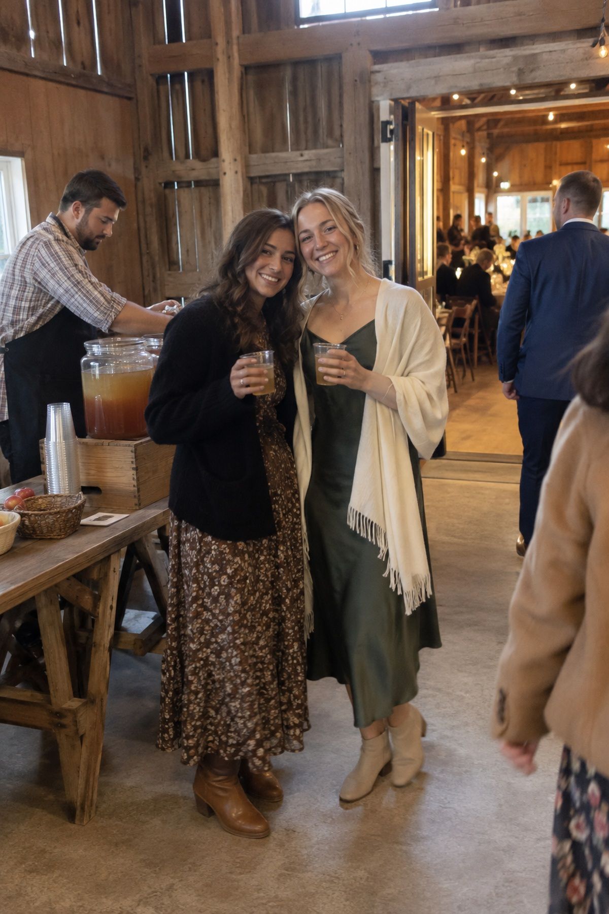 Friends pause for a quick photo beside the cider table along the route to dinner.