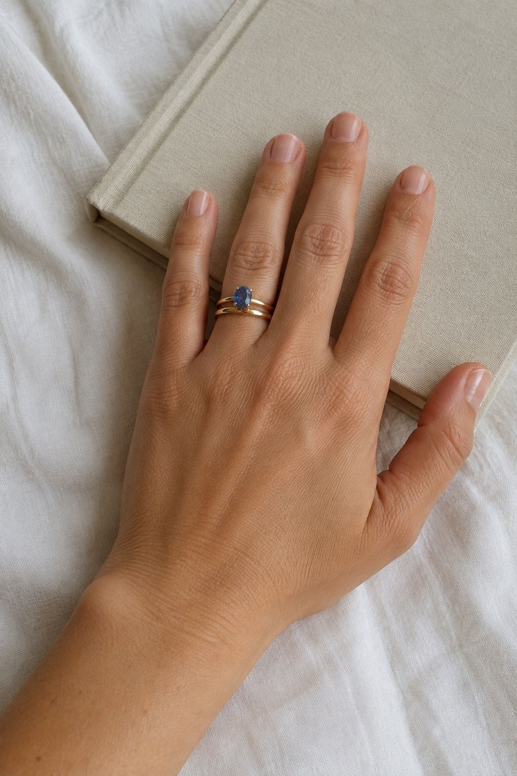 Gold sapphire ring on a plain band