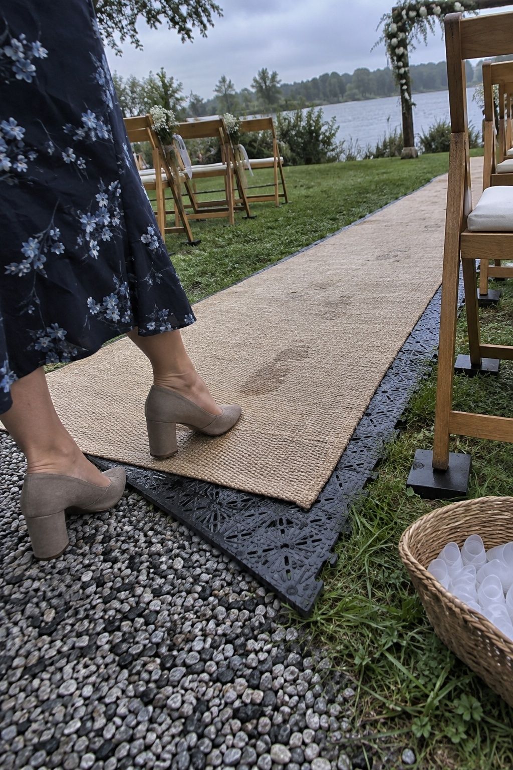 Stable wedding aisle mats and heel protectors on damp September grass