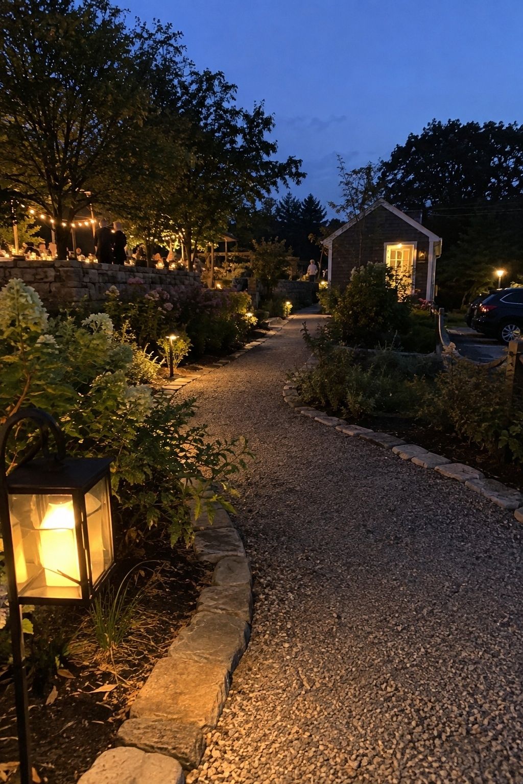 Clearly lit garden wedding pathway connecting dinner, restrooms and parking after sunset