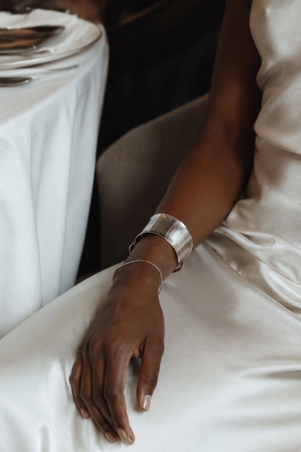 Wide silver cuff with one fine chain bracelet