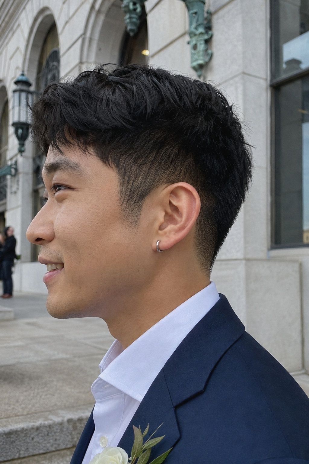 Slim silver huggie hoops at a city ceremony