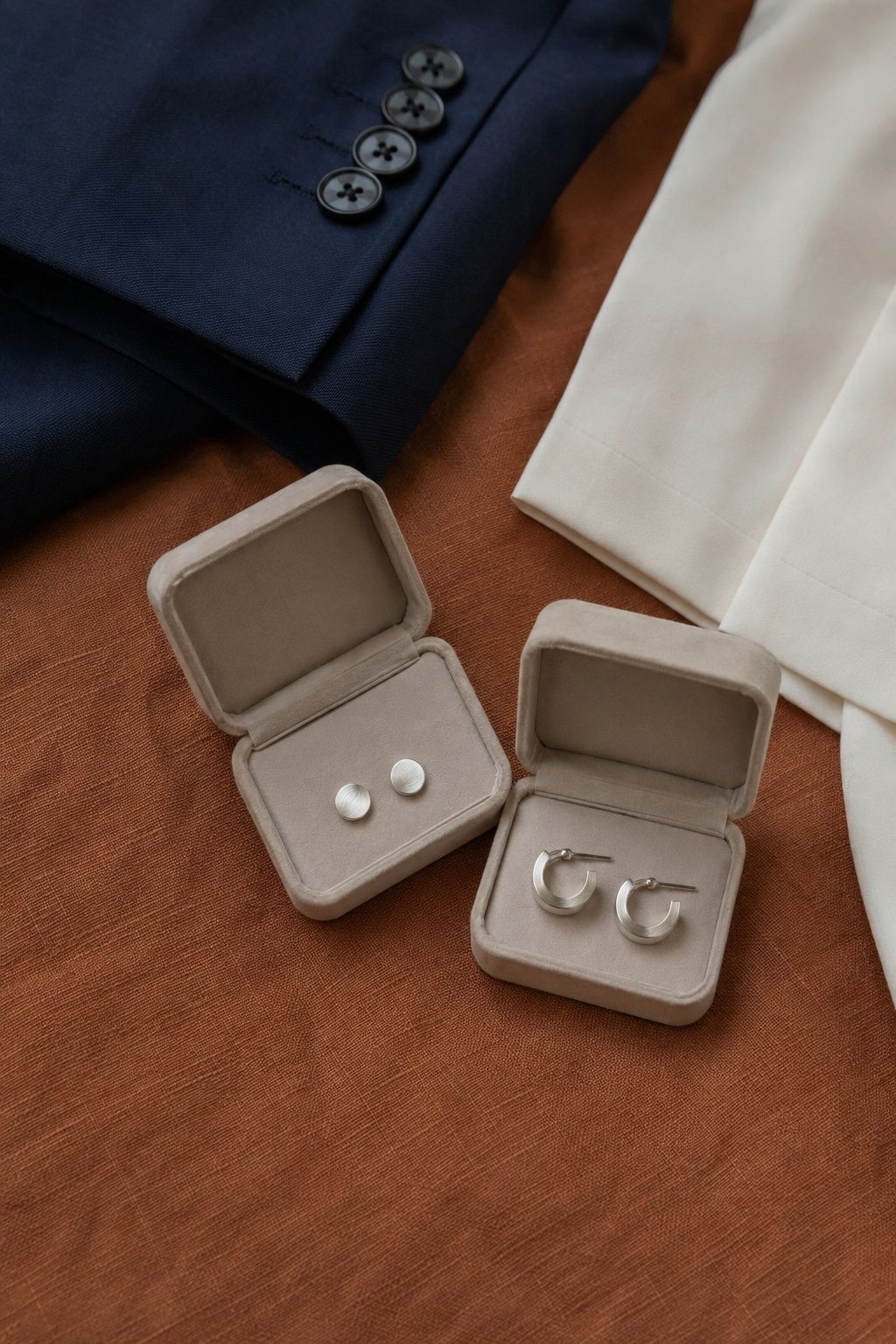 Minimal silver earrings shared by a couple