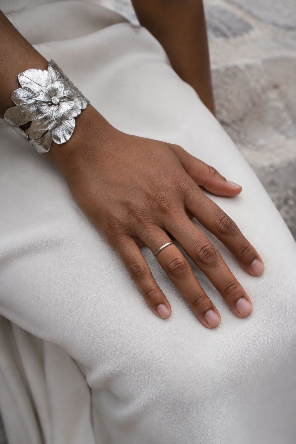 Floral cuff with simple silver rings
