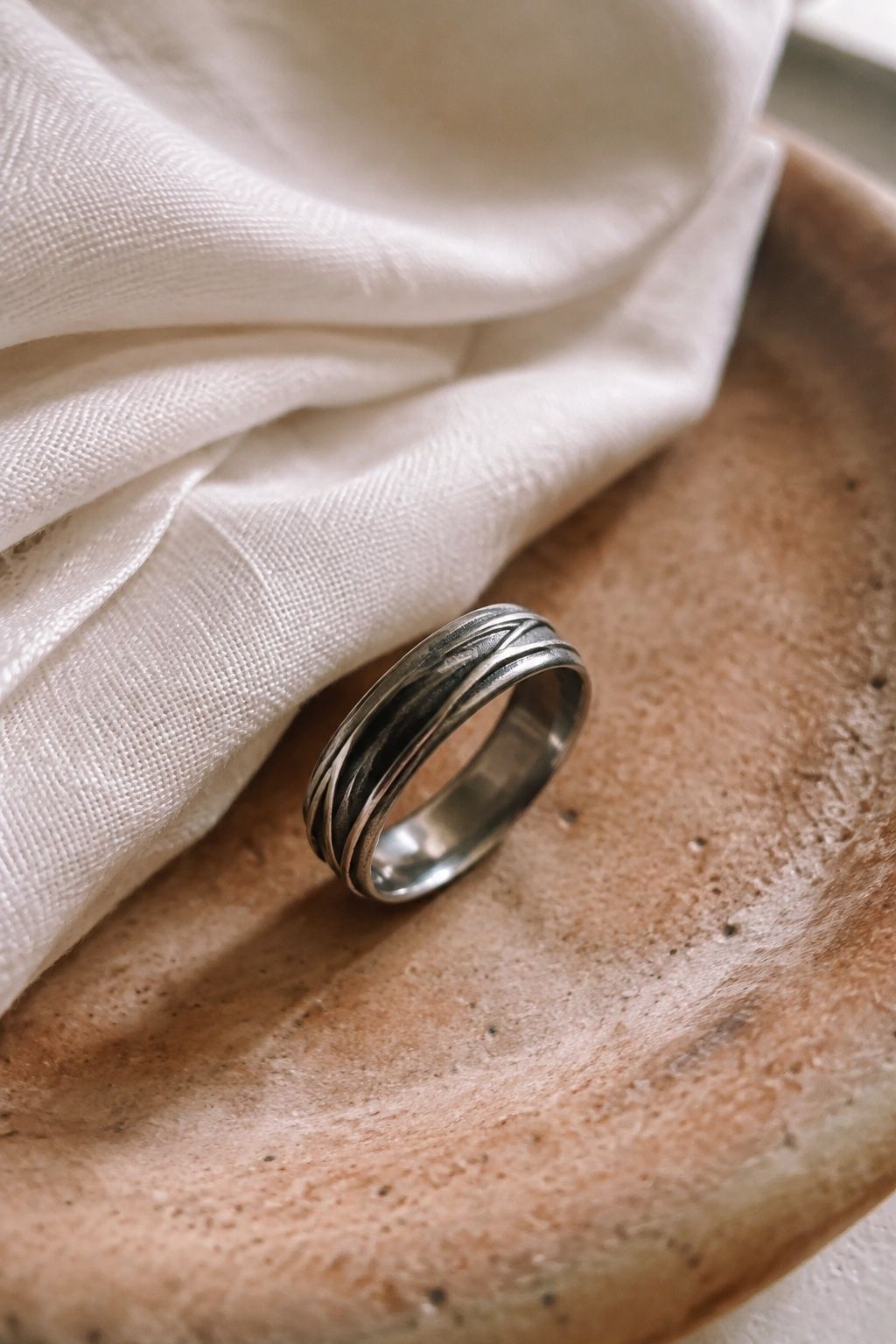 Oxidized silver ring with darker detail