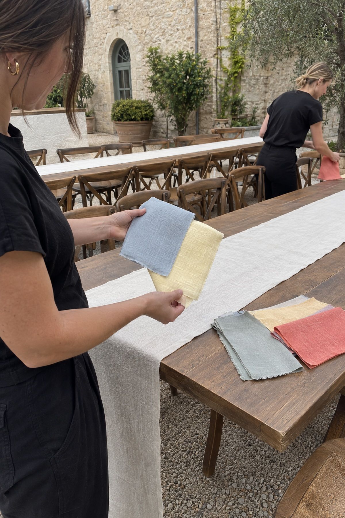 A coordinator tests pale blue, butter yellow, ivory, and warm wood for a cool summer palette.