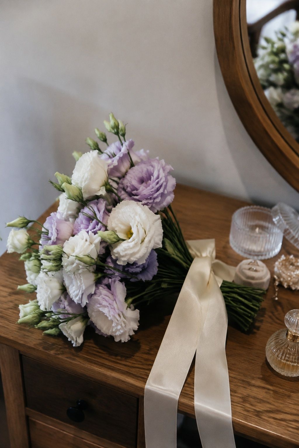 White and lavender lisianthus bridal bouquet with ivory ribbon.