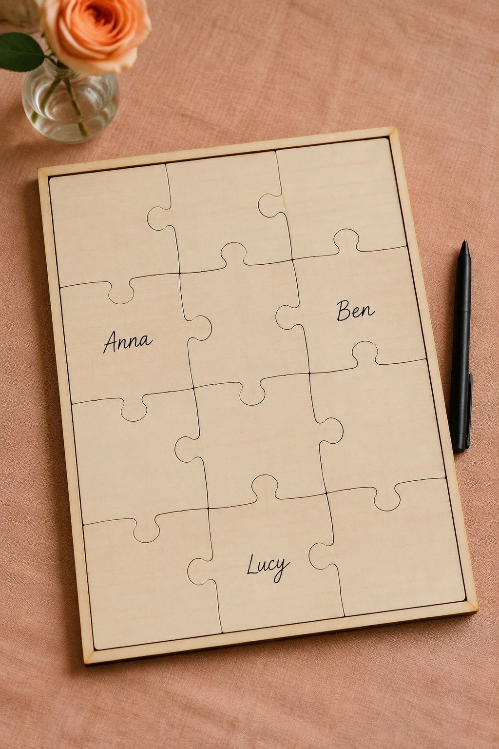 Assembled wooden puzzle guest book with names on individual pieces