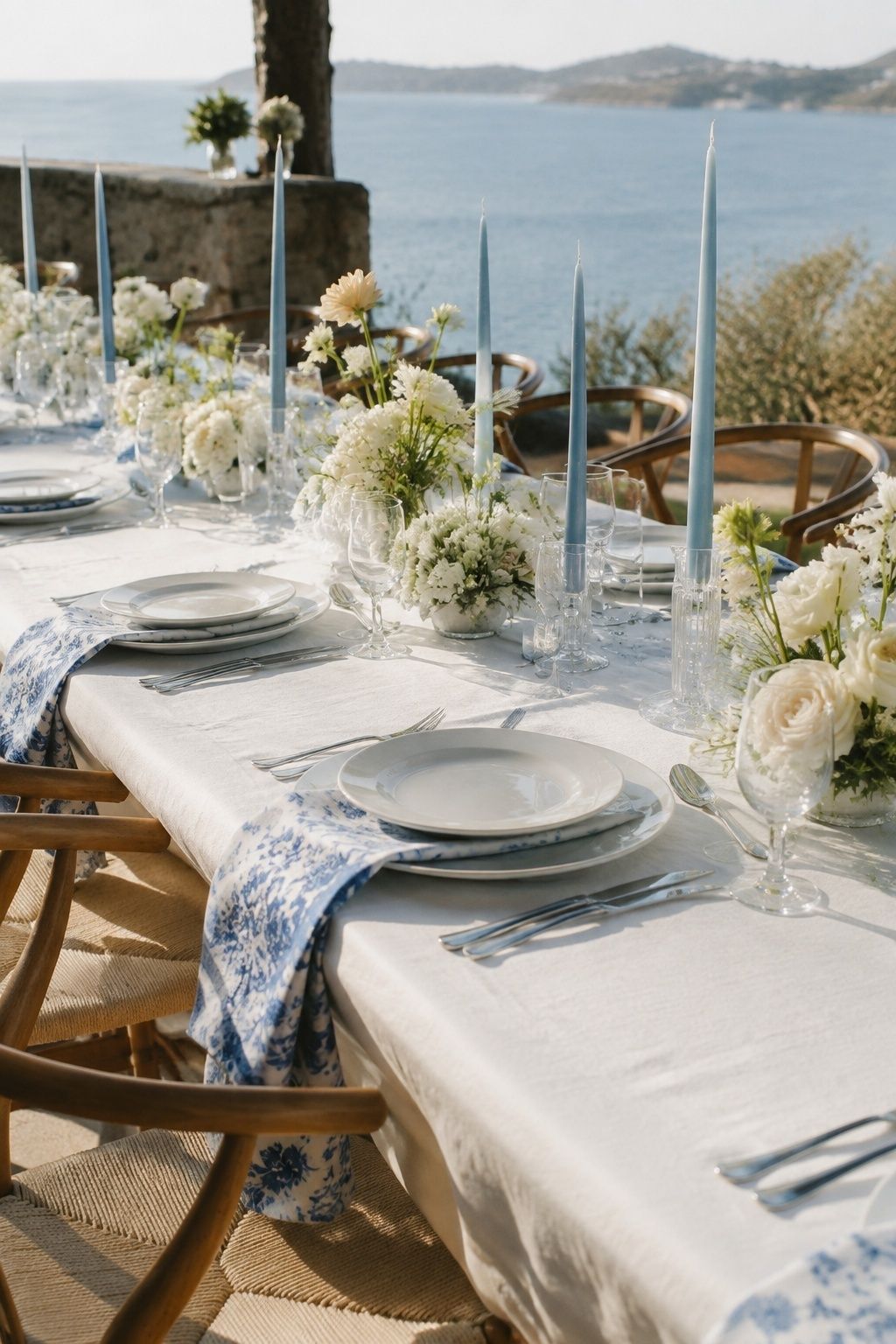Blue patterned napkins and white wedding table settings