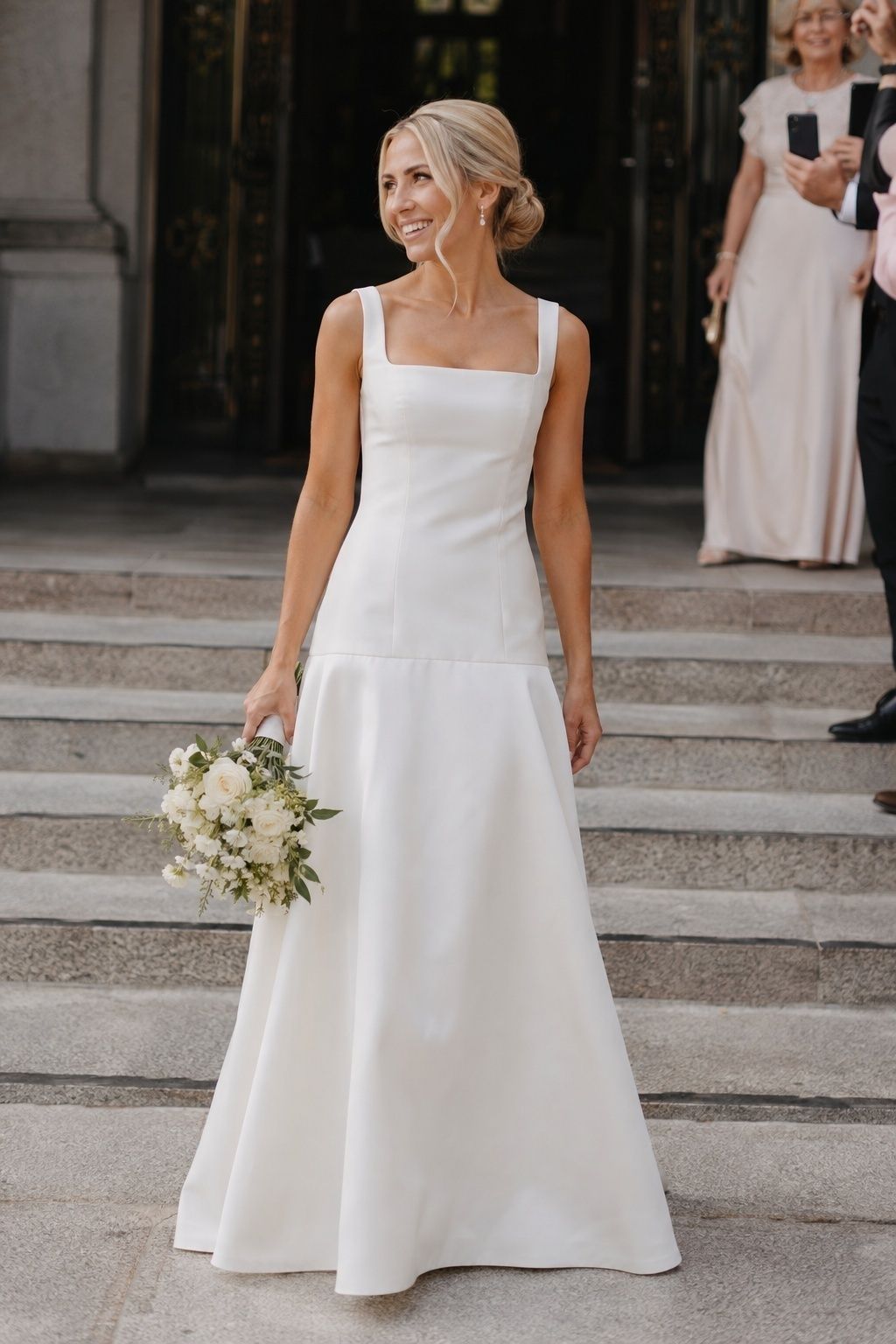 Bride wearing a dropped-waist square-neck A-line gown on city hall steps