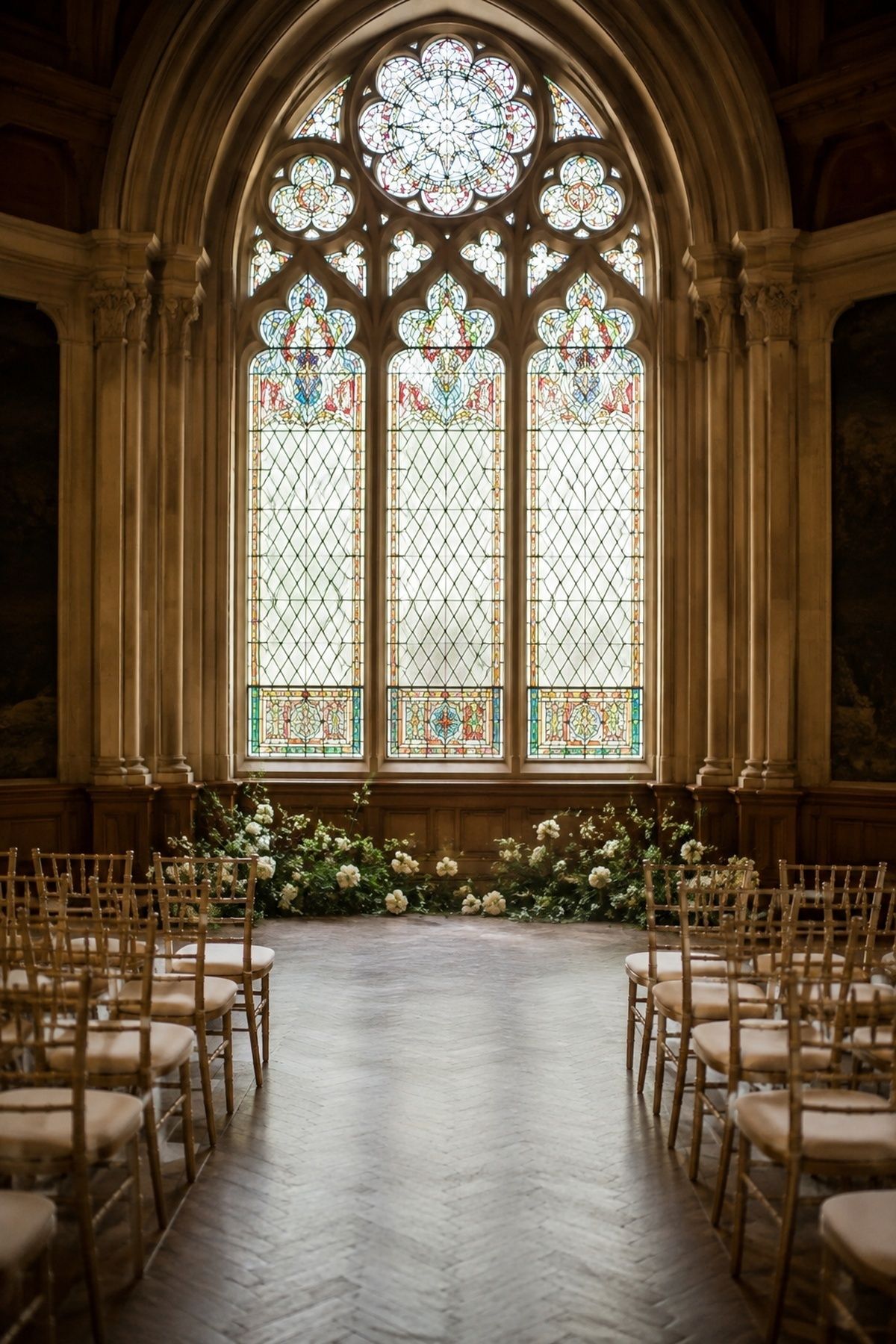 Ceremony set up in front of a chapel window